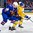 BUFFALO, NEW YORK - JANUARY 4: USA's Riley Tufte #27 and Sweden's Fabian Zetterlund #28 battle for position during the semi-final round of the 2018 IIHF World Junior Championship. (Photo by Andrea Cardin/HHOF-IIHF Images)

